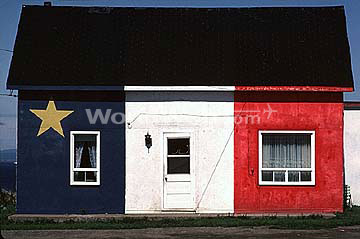 The Acadian Tricolour Flag Pointed on a Maritime Home