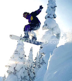 A Snowboarder Catches Air in the National Park